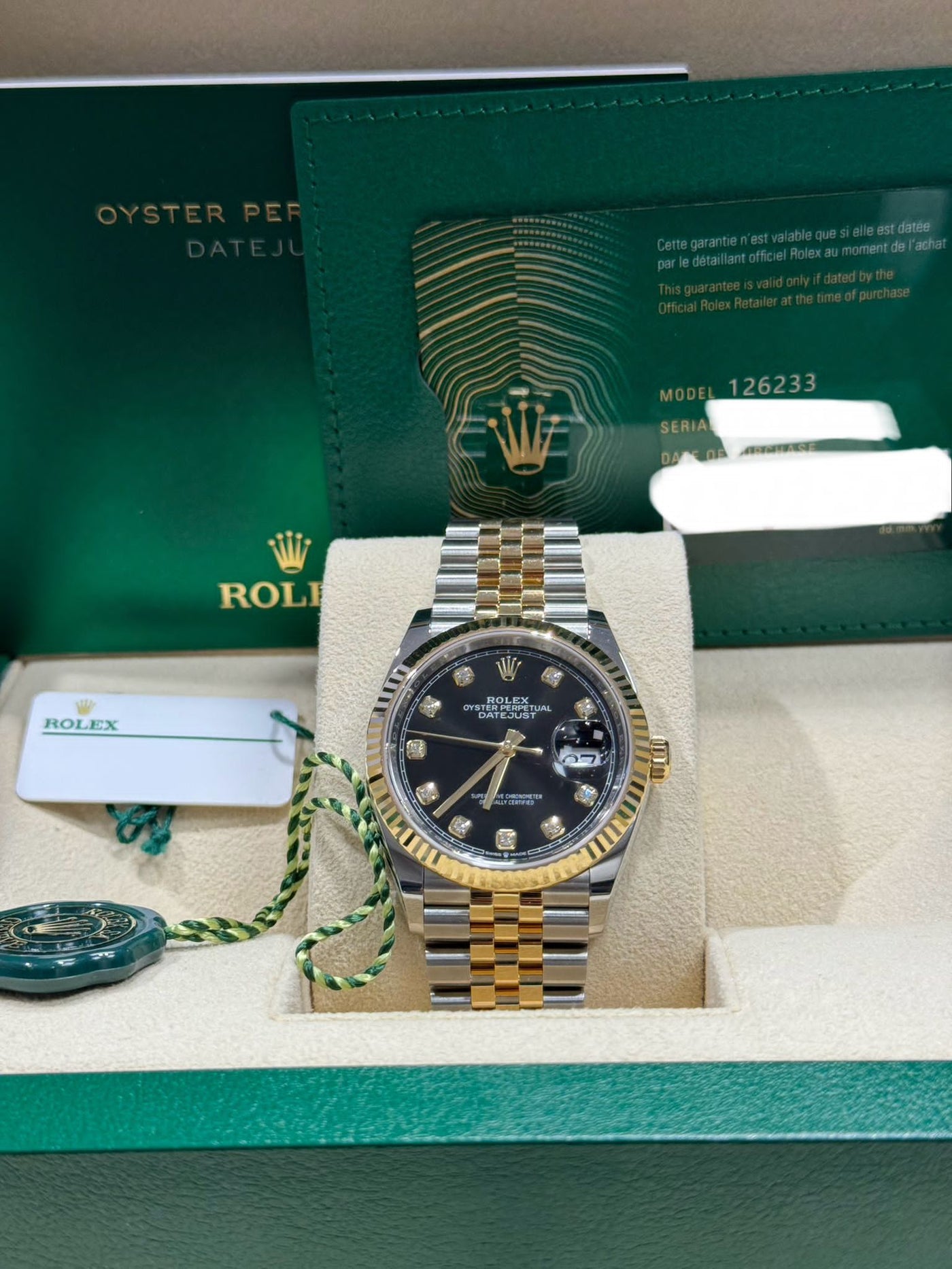 Rolex  Datejust 36, Oyster, 36 mm, Oystersteel and yellow gold,  Bright black diamond-set dial, jubilee bracelet,  126233