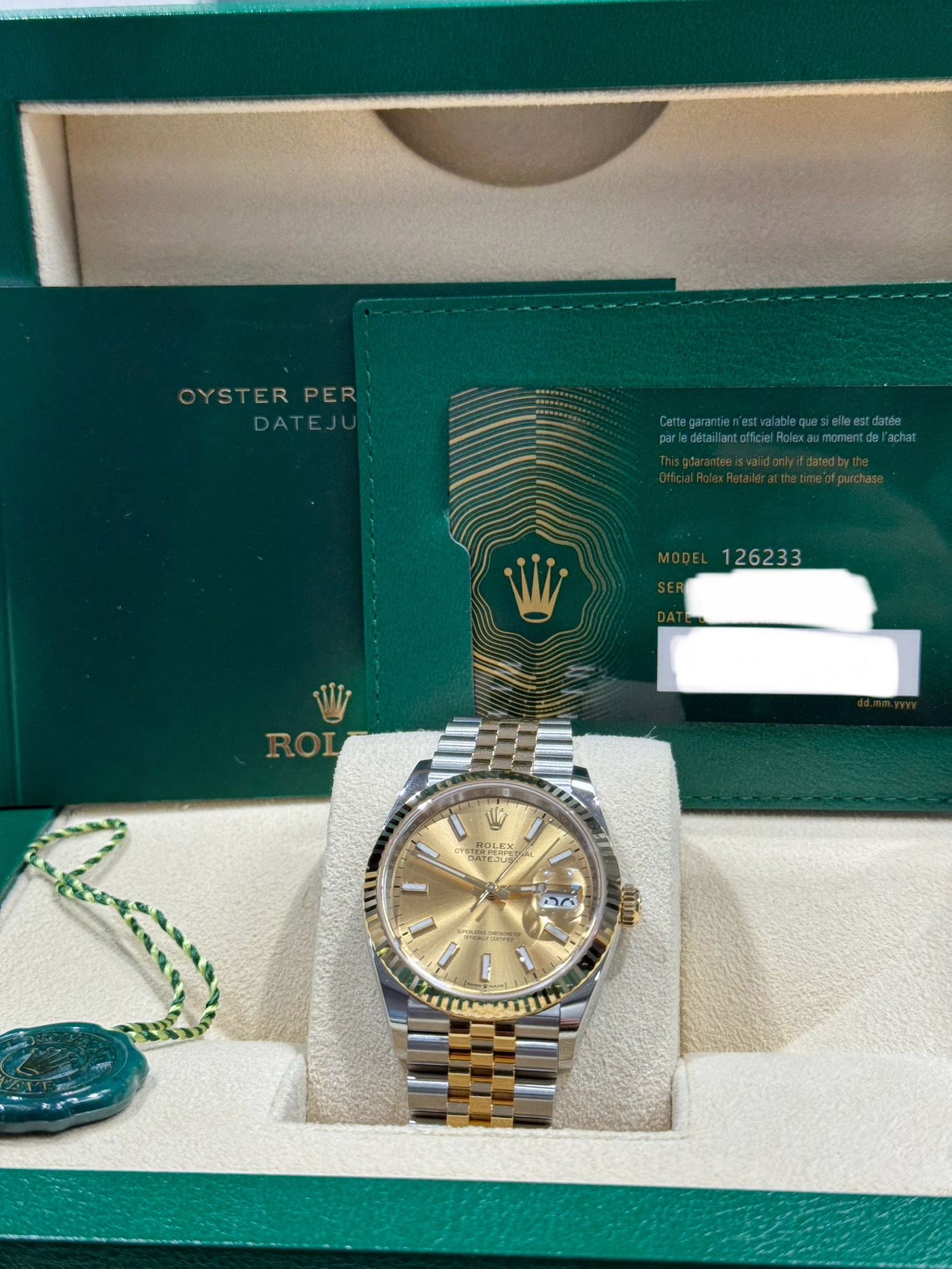 Rolex  Datejust 36, Oyster, 36 mm, Oystersteel and yellow gold,  Champagne-colour dial, jubilee bracelet, 126233