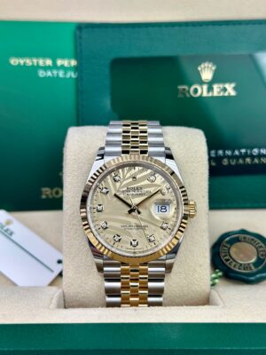 Rolex  Datejust 36, Oyster, 36 mm, Oystersteel and yellow gold,  Golden palm-motif diamond-set dial, jubilee bracelet, 126233 - Image 2